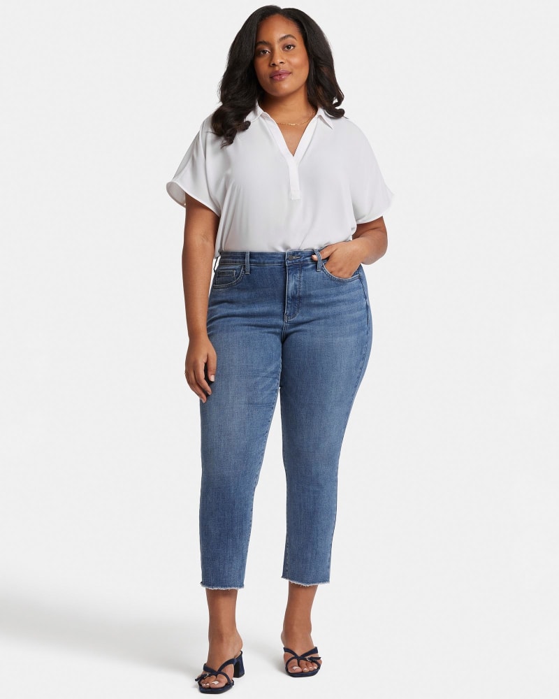 Front of a model wearing a size 24W Sheri Fray Hem Ankle Jean in Rockie by NYDJ. | dia_product_style_image_id:348305